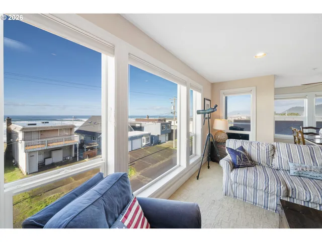 a view of living room with furniture and a window