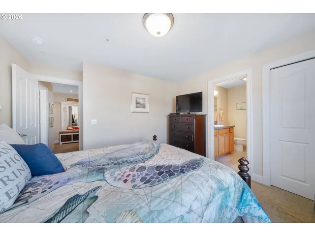 a bathroom with a granite countertop sink a toilet and a mirror