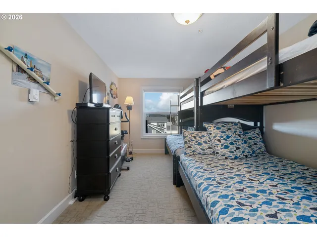 a en suite bathroom with a granite countertop sink and a mirror