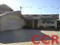 525 North Poppy Street Lompoc, CA 93436 - Photo 1 of 1 a view of backyard with brick wall