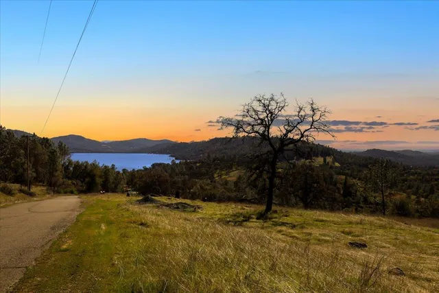 a view of a yard with a mountain