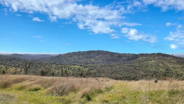 a view of mountains and valleys