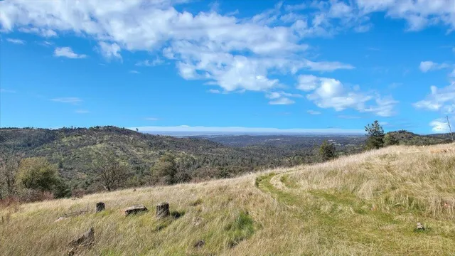 a view of mountain view with mountains in the background