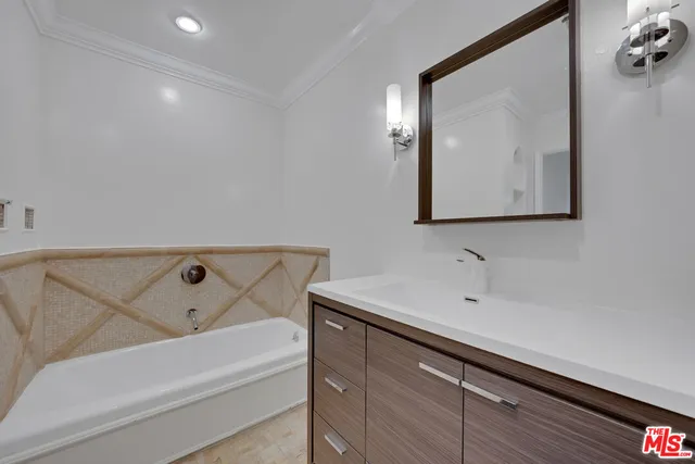 a bathroom with a bathtub and a sink