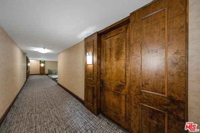 a spacious bedroom with a bed and a couch