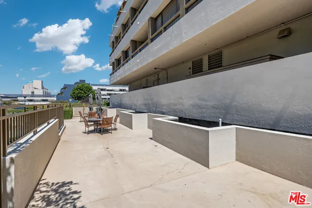 a view of swimming pool with outdoor seating
