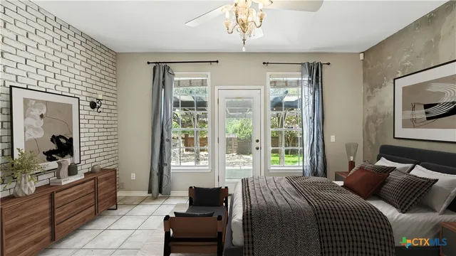 a bedroom with a large bed and a window