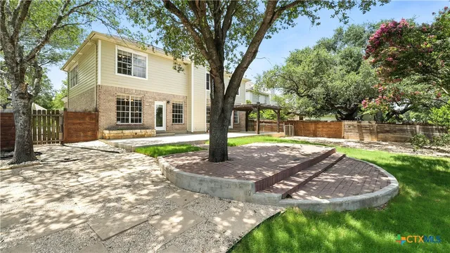 a view of a trees with yard