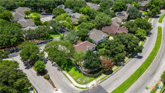 an aerial view of residential house with outdoor space and swimming pool