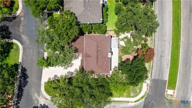 an aerial view of a house with a garden