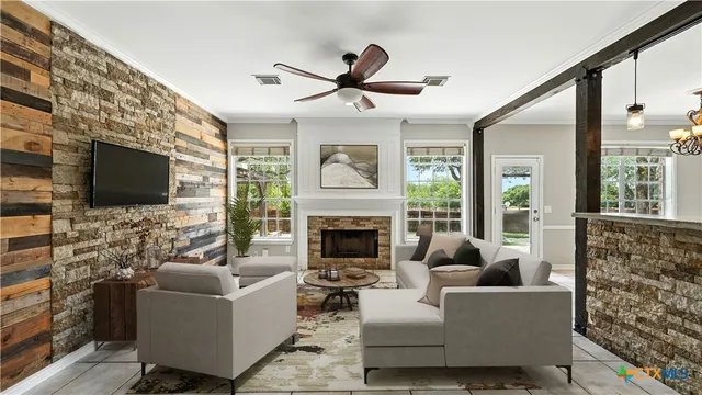 a living room with furniture a fireplace and a flat screen tv