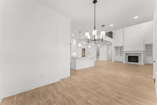 a view of a kitchen with granite countertop cabinets and wooden floor