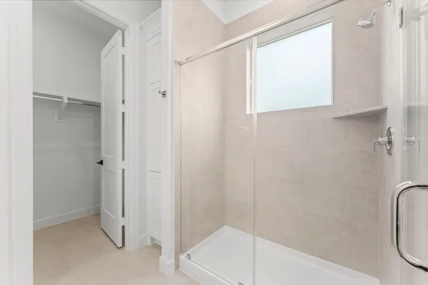 a bathroom with a shower and a tub