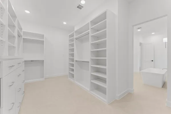 a view of an empty walk in closet
