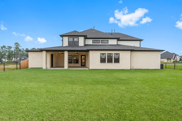 a view of a house with a backyard