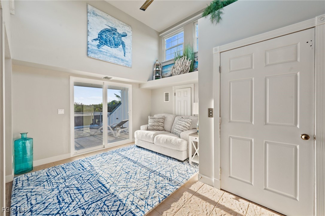 7507 Grande Pine Road Bokeelia, FL 33922 - Photo 11 of 46 a living room with furniture and a rug