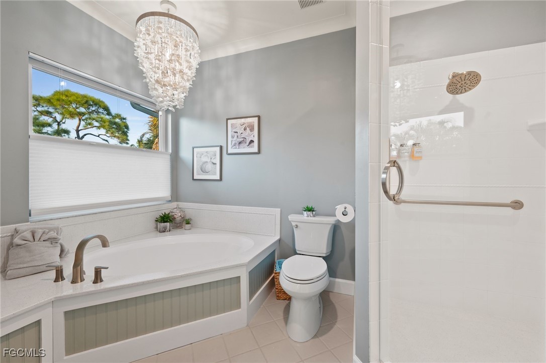 7507 Grande Pine Road Bokeelia, FL 33922 - Photo 23 of 46 a bathroom with a sink a toilet and shower