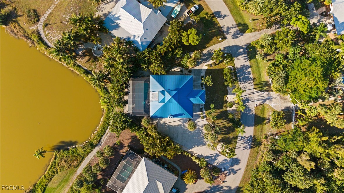 7507 Grande Pine Road Bokeelia, FL 33922 - Photo 34 of 46 a view of a house with a yard