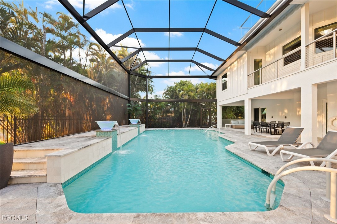 7507 Grande Pine Road Bokeelia, FL 33922 - Photo 37 of 46 a view of a swimming pool with a patio