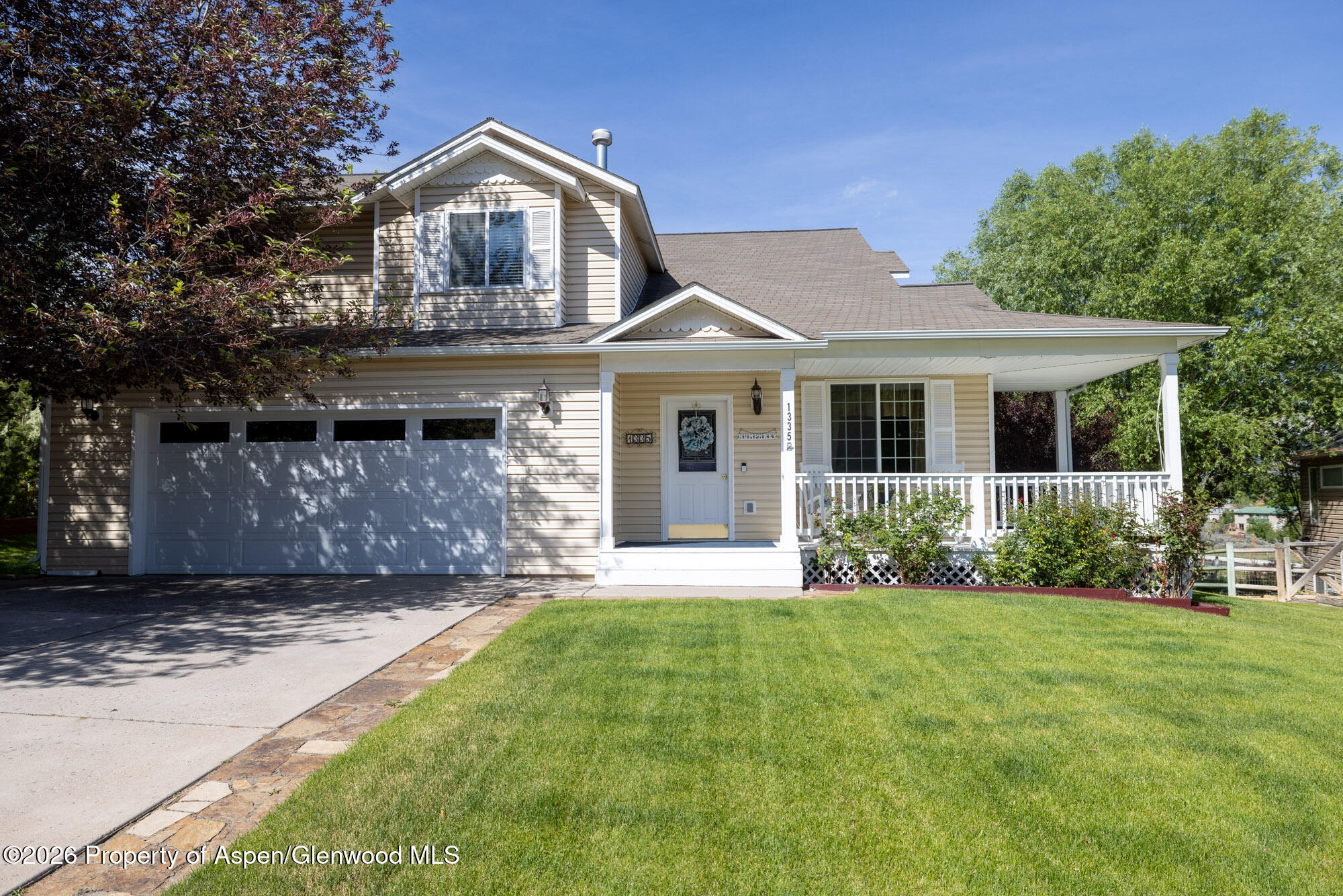 1335 Firethorn Drive Rifle, CO 81650 - Photo 2 of 30 a front view of a house with a yard