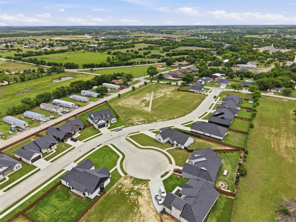 516 Highview Court Godley, TX 76044 - Photo 13 of 15 an aerial view of a residential houses with outdoor space and a lake view