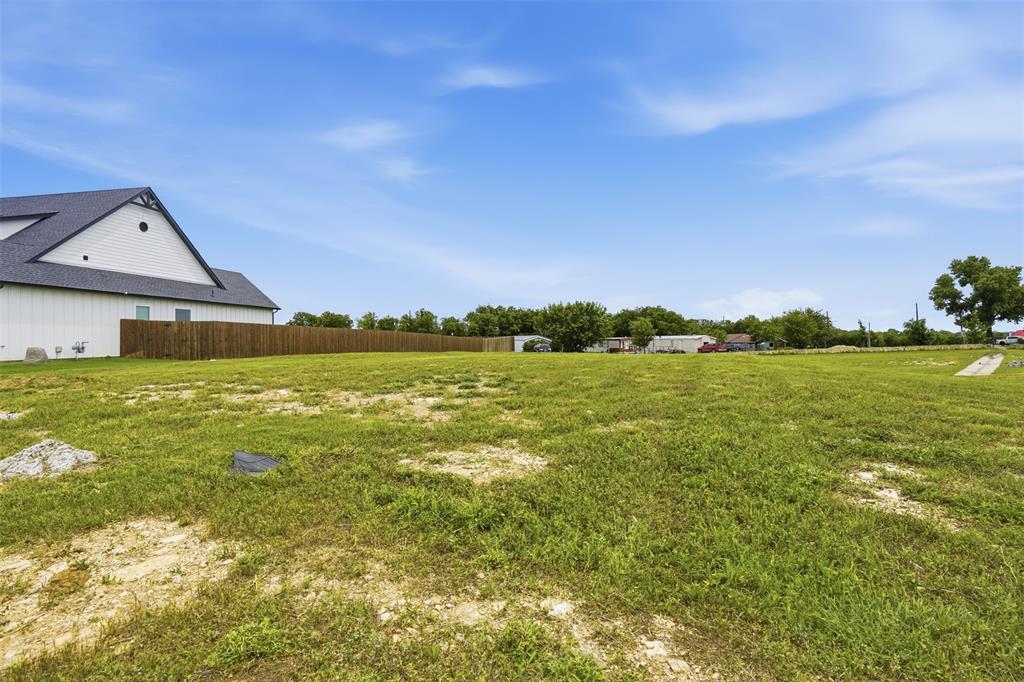 516 Highview Court Godley, TX 76044 - Photo 5 of 15 a view of a large body of water with a building in the background