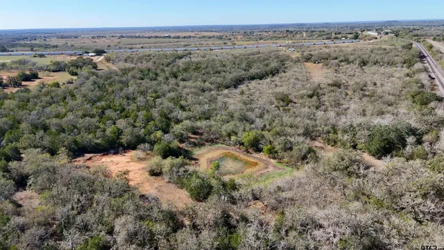 an aerial view of house with beach