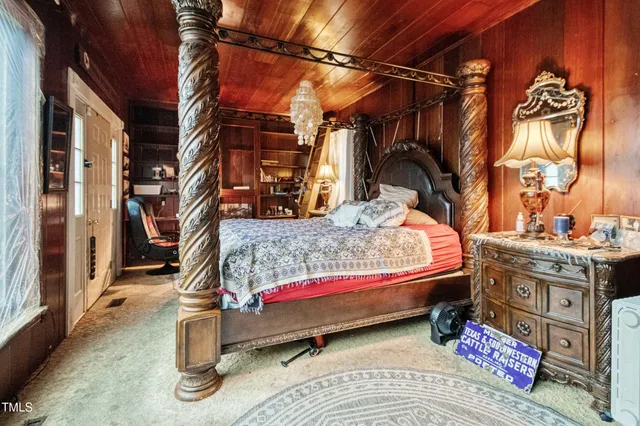a backyard of a house with barbeque oven table and chairs