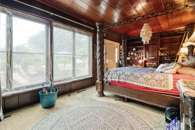 a bedroom with furniture and a window