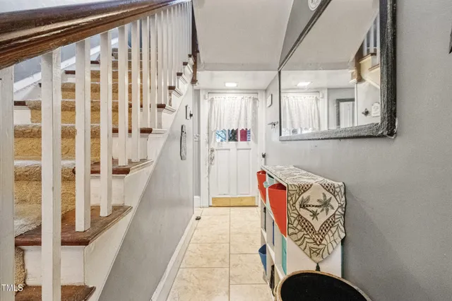 a view of entryway and hall with wooden floor