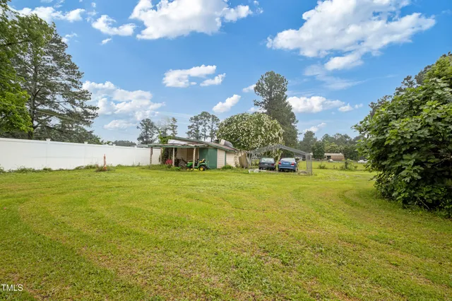 a view of an outdoor space and basketball court