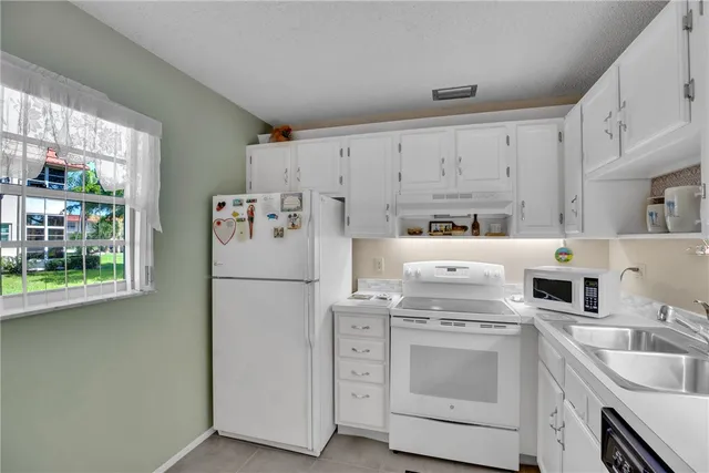 a view of a brick house with an outdoor space