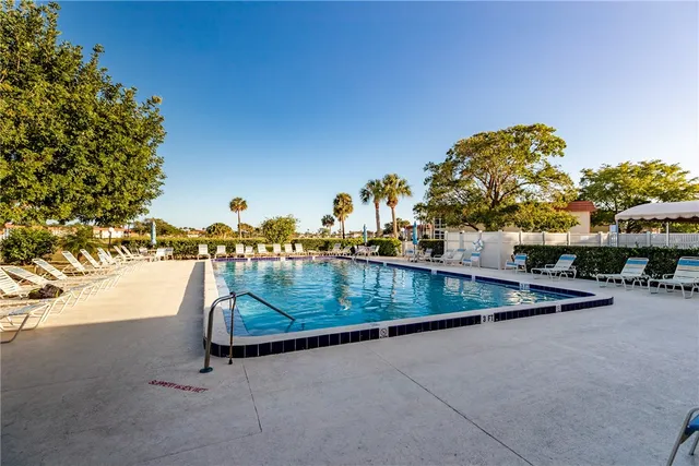 a view of a chairs and table on the balcony