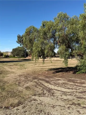 a view of outdoor space with swimming pool and trees