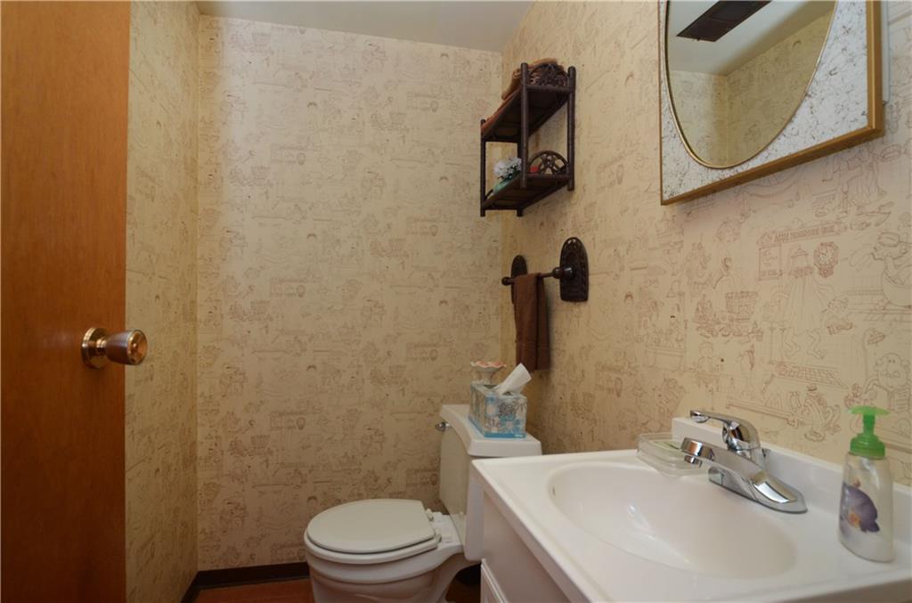 207 Lytton Road Coraopolis, PA 15108 - Photo 11 of 17 a bathroom with a sink mirror and toilet