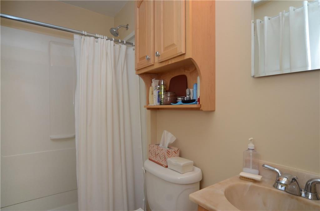207 Lytton Road Coraopolis, PA 15108 - Photo 12 of 17 a bathroom with a toilet a sink and curtain