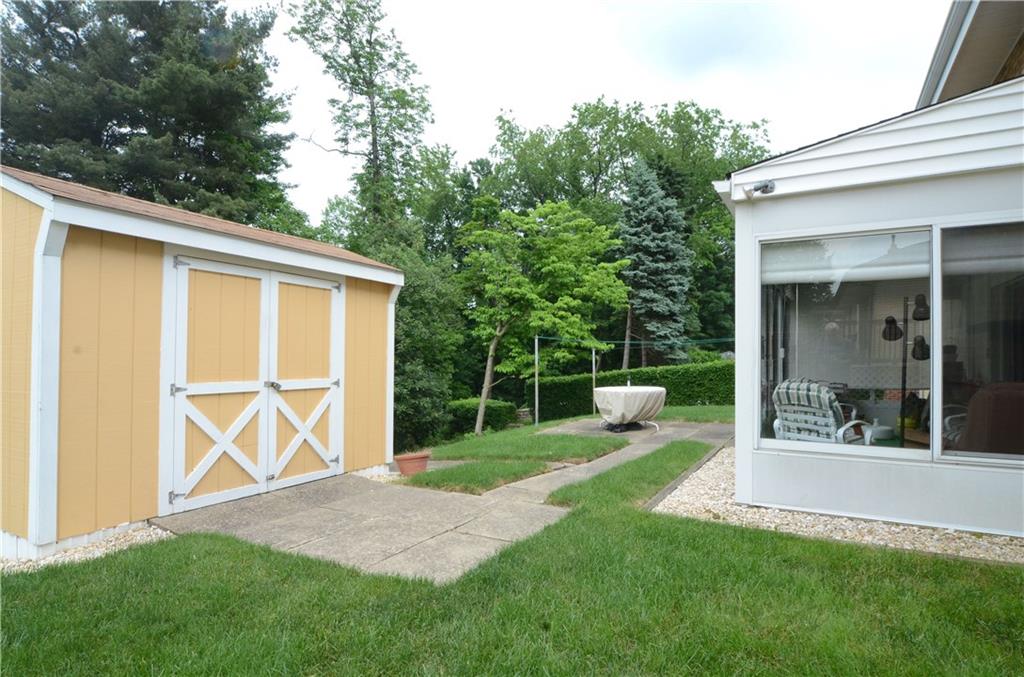 207 Lytton Road Coraopolis, PA 15108 - Photo 14 of 17 a view of a chair and table in the back yard of the house