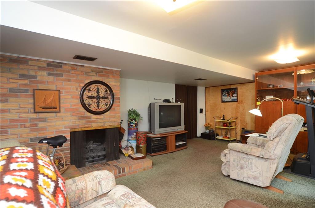 207 Lytton Road Coraopolis, PA 15108 - Photo 4 of 17 a living room with furniture a flat screen tv and a fireplace