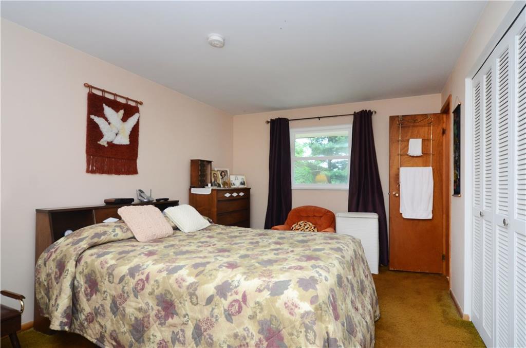 207 Lytton Road Coraopolis, PA 15108 - Photo 6 of 17 a bedroom with a bed and wooden floor