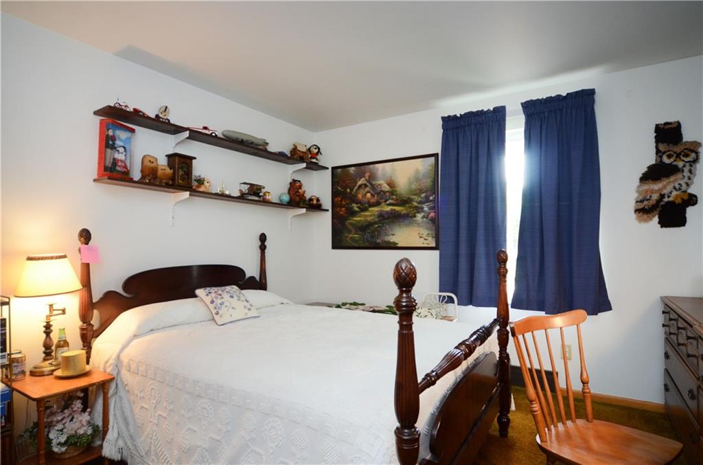 207 Lytton Road Coraopolis, PA 15108 - Photo 7 of 17 a bedroom with a bed and a flat screen tv