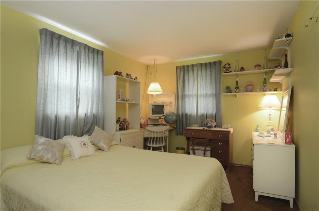 207 Lytton Road Coraopolis, PA 15108 - Photo 8 of 17 a bedroom with a bed and a refrigerator