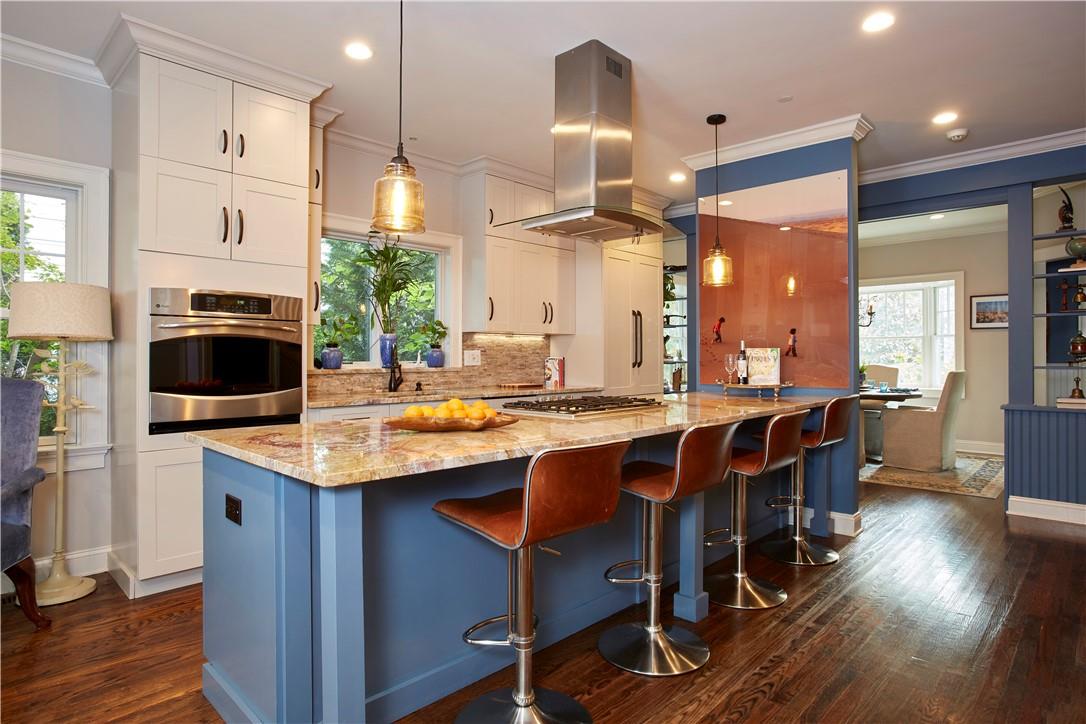 126 Wappanocca Avenue Rye, NY 10580 - Photo 1 of 1 a kitchen with stainless steel appliances kitchen island a dining table and chairs
