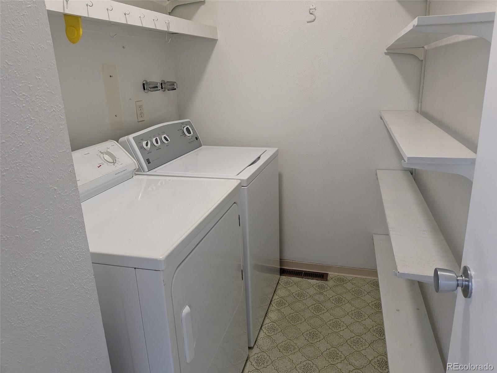 6440 Wright Street Arvada, CO 80004 - Photo 8 of 15 a utility room with dryer and washer
