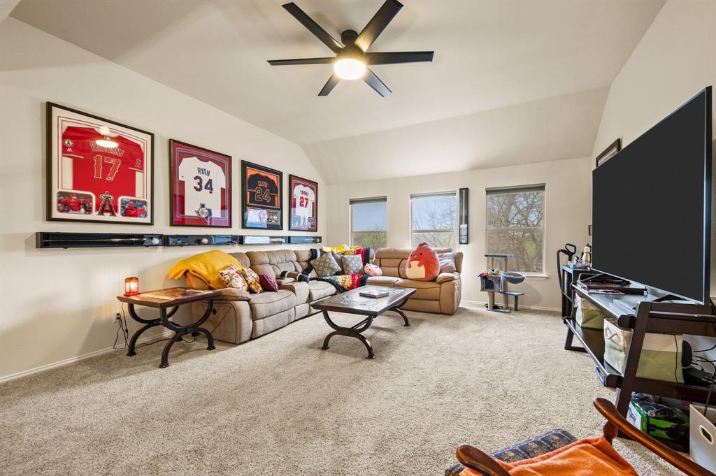 4008 Falcon Ridge Drive Haltom City, TX 76137 - Photo 18 of 32 a living room with furniture and a flat screen tv