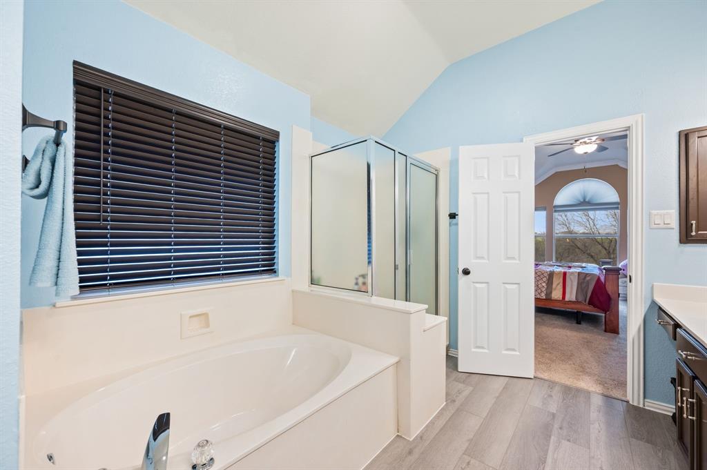 4008 Falcon Ridge Drive Haltom City, TX 76137 - Photo 23 of 32 a bathroom with a tub and a view of bathroom