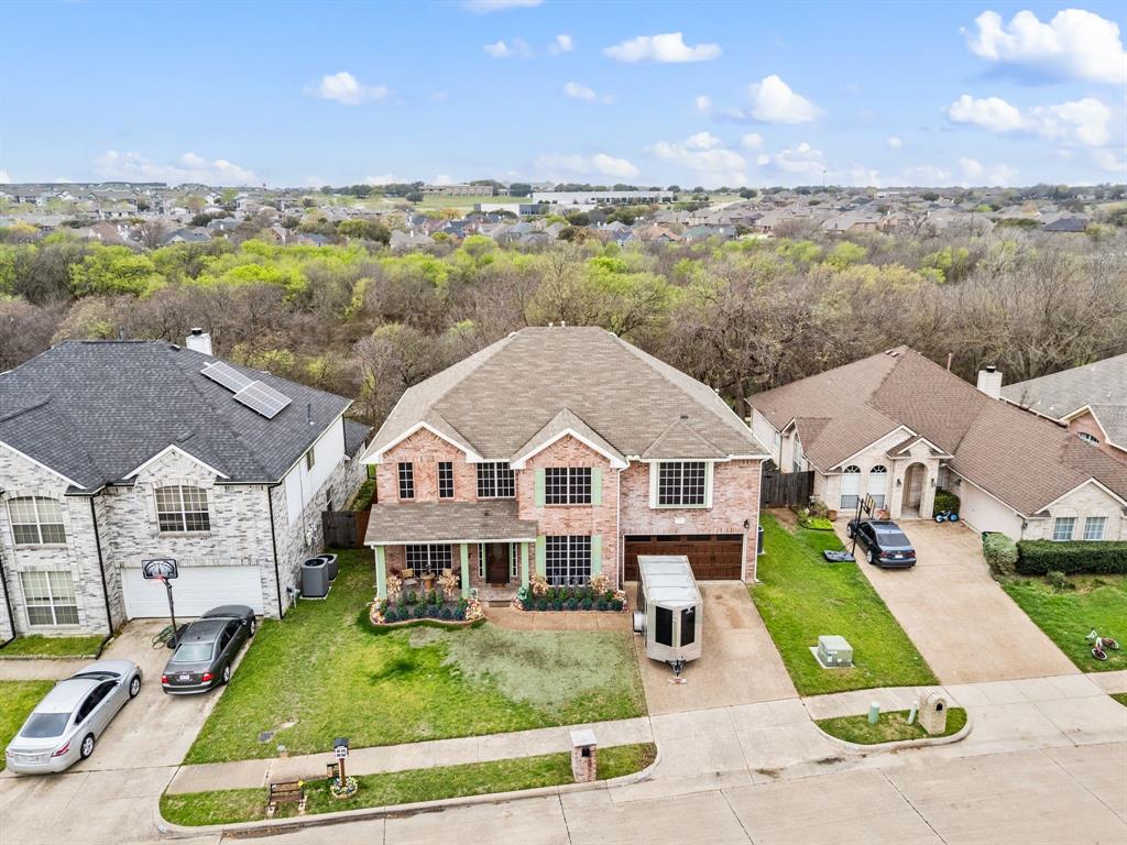 4008 Falcon Ridge Drive Haltom City, TX 76137 - Photo 5 of 32 an aerial view of a house with a garden view