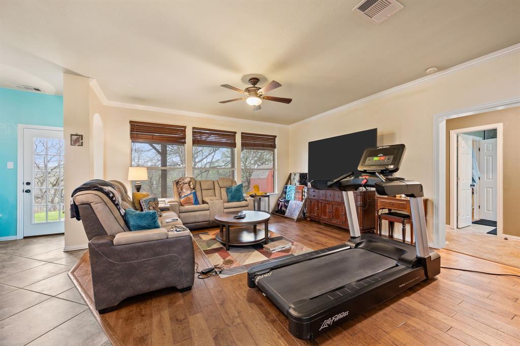 4008 Falcon Ridge Drive Haltom City, TX 76137 - Photo 10 of 32 a living room with furniture and a flat screen tv