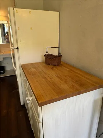 a view of kitchen and wooden floor