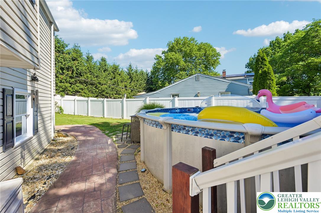 2649 Nottingham Road Bethlehem, PA 18017 - Photo 37 of 49 An inviting backyard oasis offers a sparkling above-ground pool, perfect for sunny day relaxation.