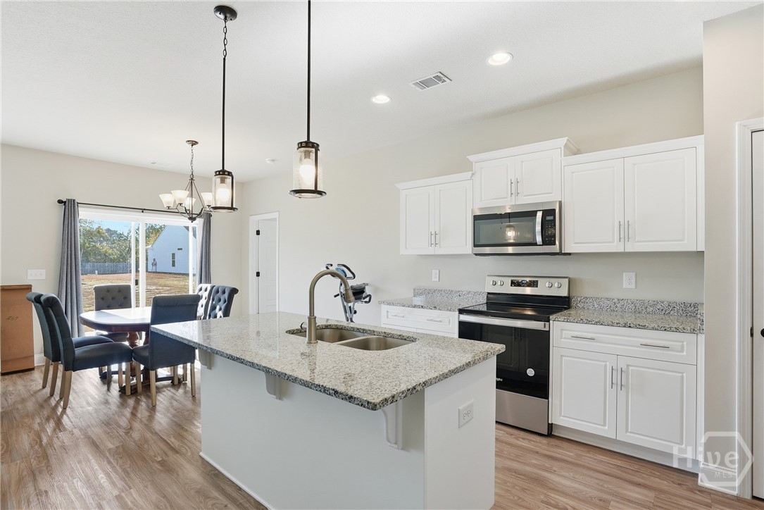 141 Haydon Court Rincon, GA 31326 - Photo 10 of 43 Kitchen and Dining Room View